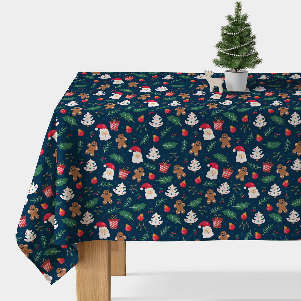 obrus granatowy z Mikołajem piernikami i ozdobami zimowy klimat
