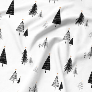 zimowy wzór z choinkami na białej podkładce – zbliżenie tkaniny