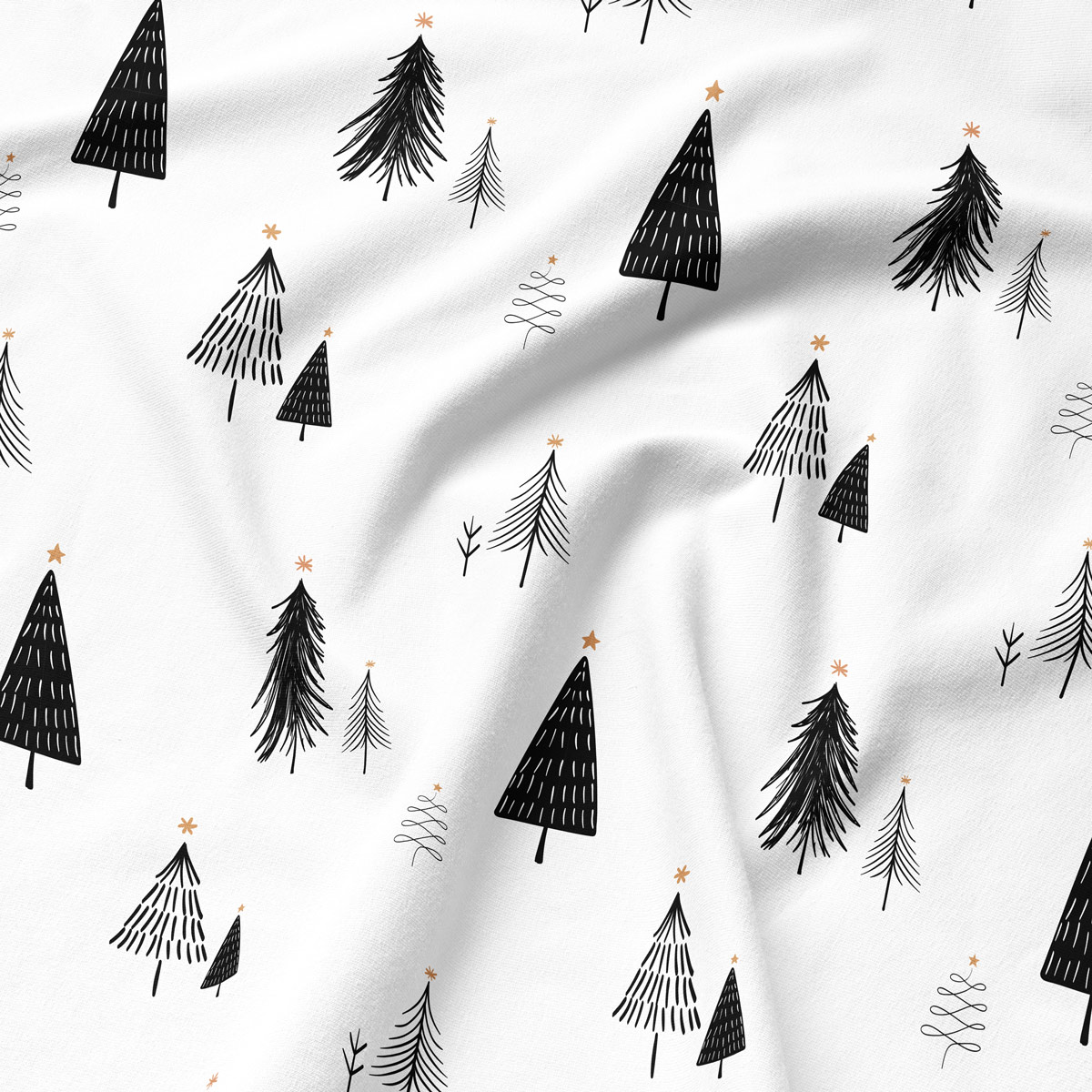 zimowy wzór z choinkami na białej podkładce – zbliżenie tkaniny