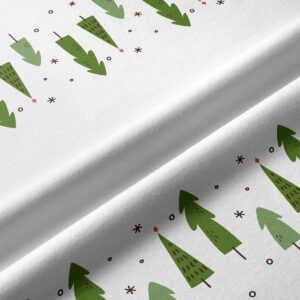tkanina z zielonym świątecznym motywem choinek