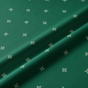 tkanina zielona z delikatnym wzorem świątecznym – detal materiału