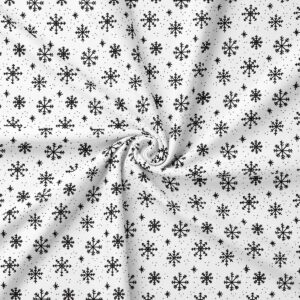 obrus zbliżenie tkaniny z czarnymi płatkami śniegu