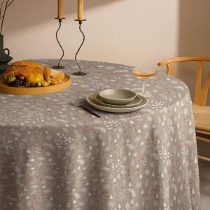 beżowy obrus świąteczny okrągły z zimowym wzorem gałązek