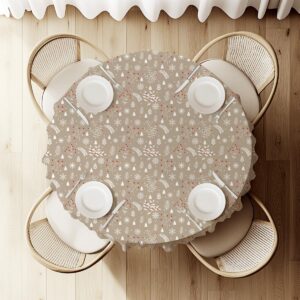 beżowy obrus świąteczny okrągły z zimowym wzorem gałązek