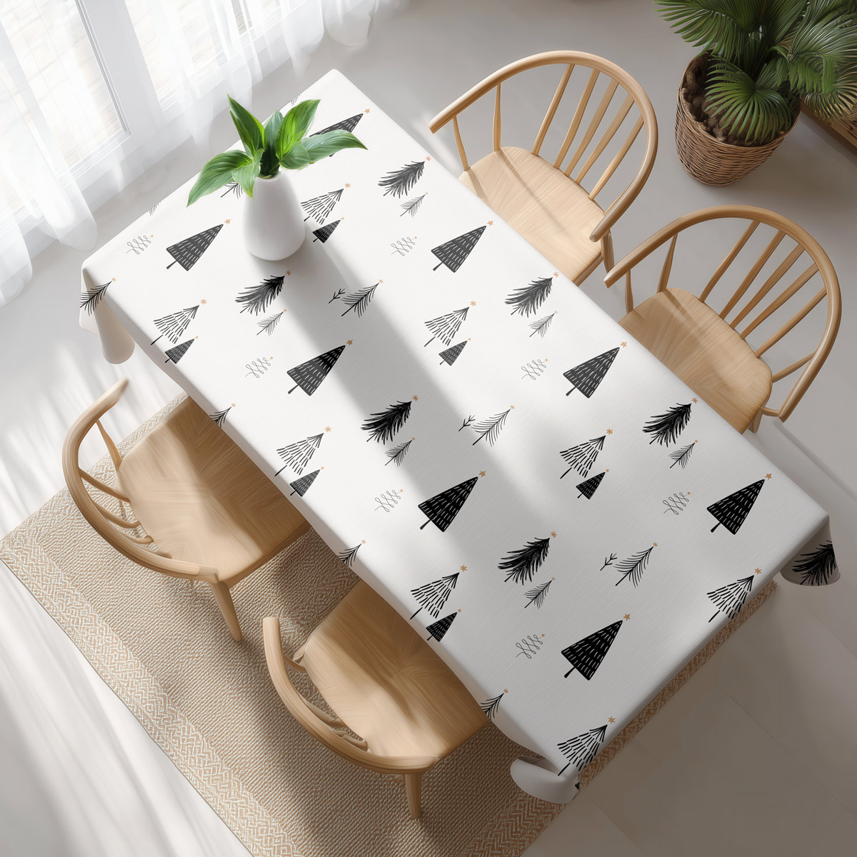 widok z góry na obrus z czarnym wzorem choinek