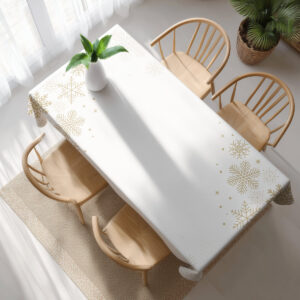 zimowy obrus ze złotymi śnieżynkami na jasnym tle