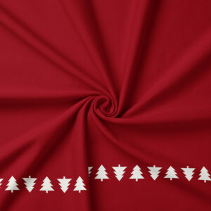 tkanina czerwona z choinkowym motywem przy brzegu