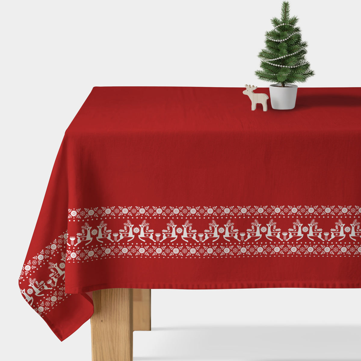czerwony obrus świąteczny z reniferami i białym ornamentem