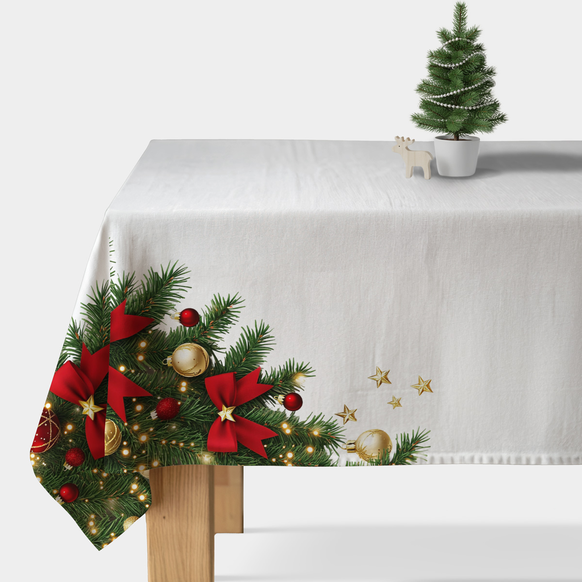 obrus świąteczny biały z zielonymi gałązkami i czerwonymi kokardami