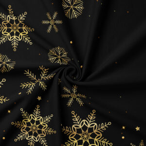 zbliżenie na tkaninę czarnego obrusu ze złotym wzorem śnieżynek