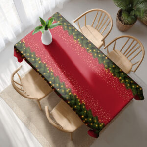 świąteczny obrus na stół w czerwonym kolorze z dekoracją świerkową