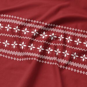 Tkanina w odcieniu bordo z jasnym skandynawskim motywem – zbliżenie materiału