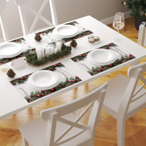 świąteczna aranżacja stołu z podkładkami z bombkami i zielonymi gałązkami