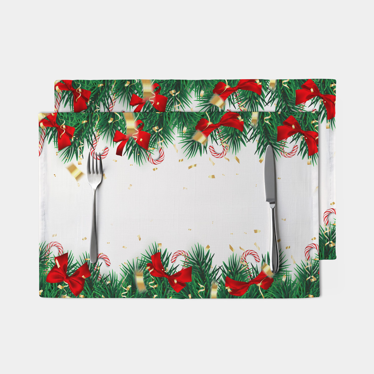 świąteczna podkładka na stół z zielonymi gałązkami i czerwonymi kokardami