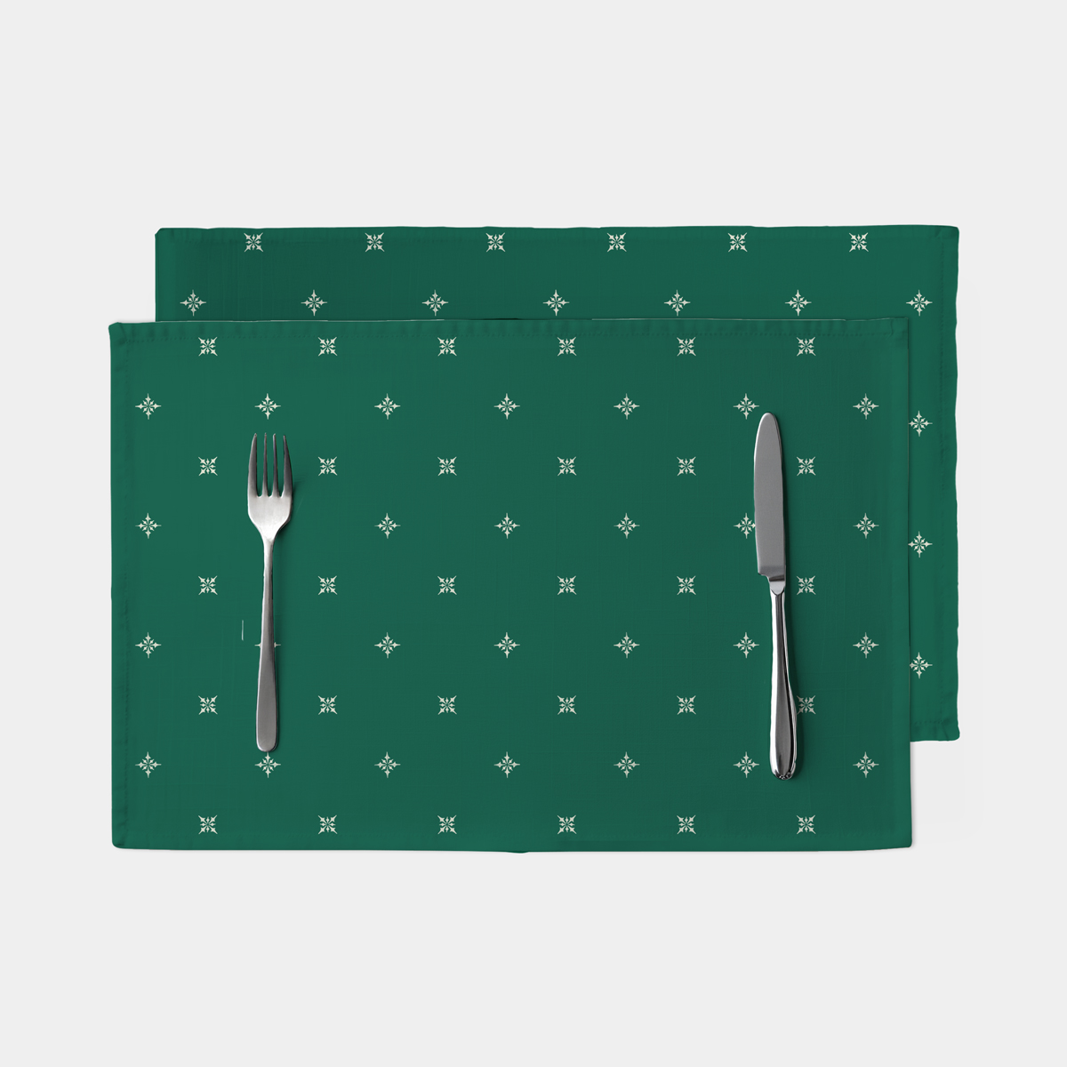 Zbliżenie tkaniny – zielona tkanina z drobnym klasycznym wzorem.