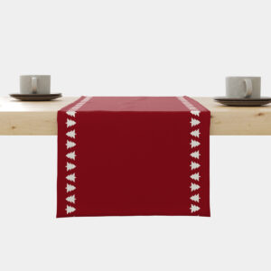 czerwony świąteczny bieżnik z białymi choinkami przy krawędzi