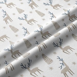 tkanina z beżowymi reniferami — detal materiału