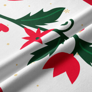 detal tkaniny z czerwono-zielonym motywem roślinnym na białym tle