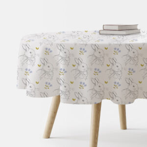 Okrągły obrus wielkanocny biały w króliczki na stole