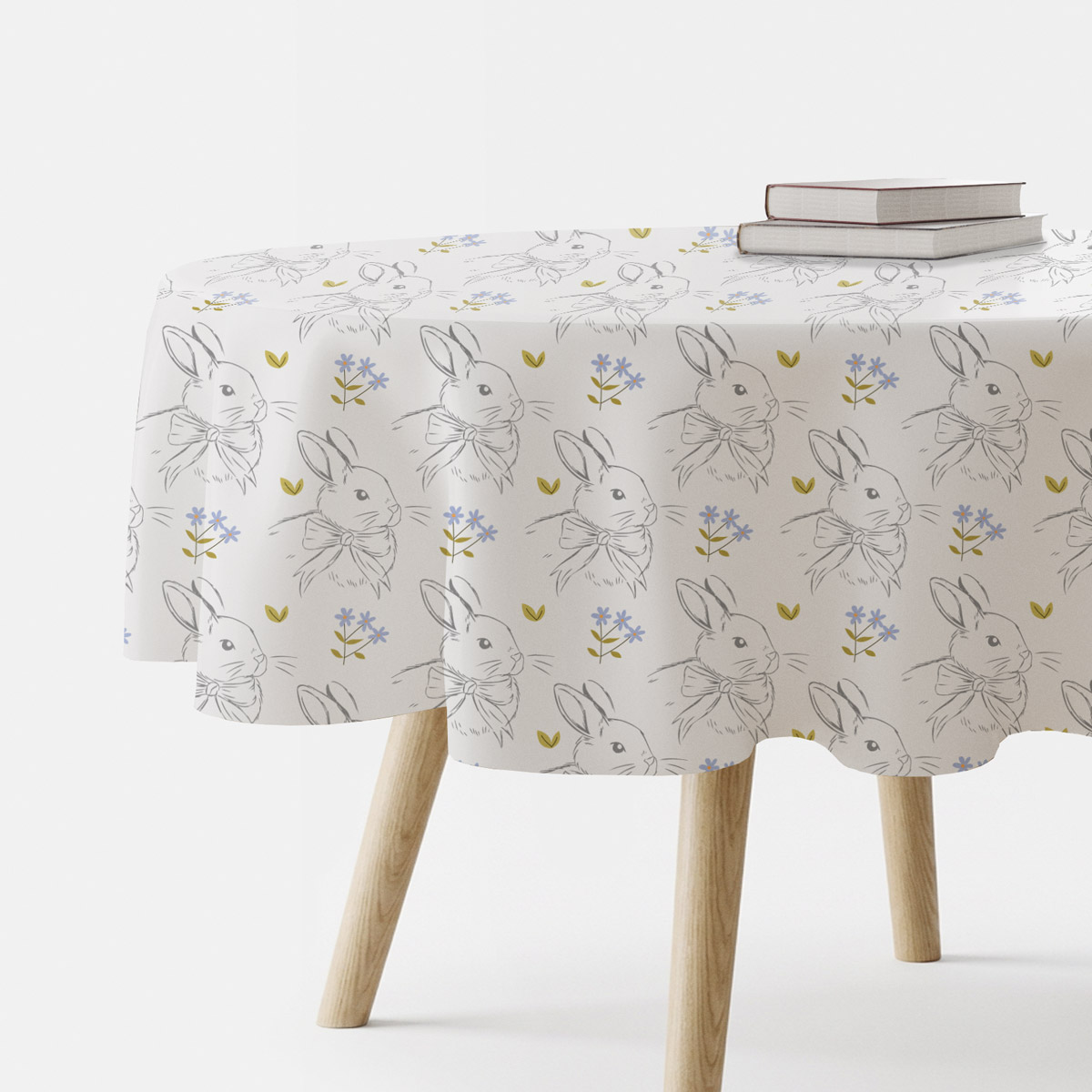 Okrągły obrus wielkanocny biały w króliczki na stole