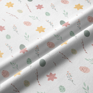 Zbliżenie na wzór bieżnika: pastelowe pisanki, małe kwiatki i gałązki oraz widoczna delikatna faktura tkaniny