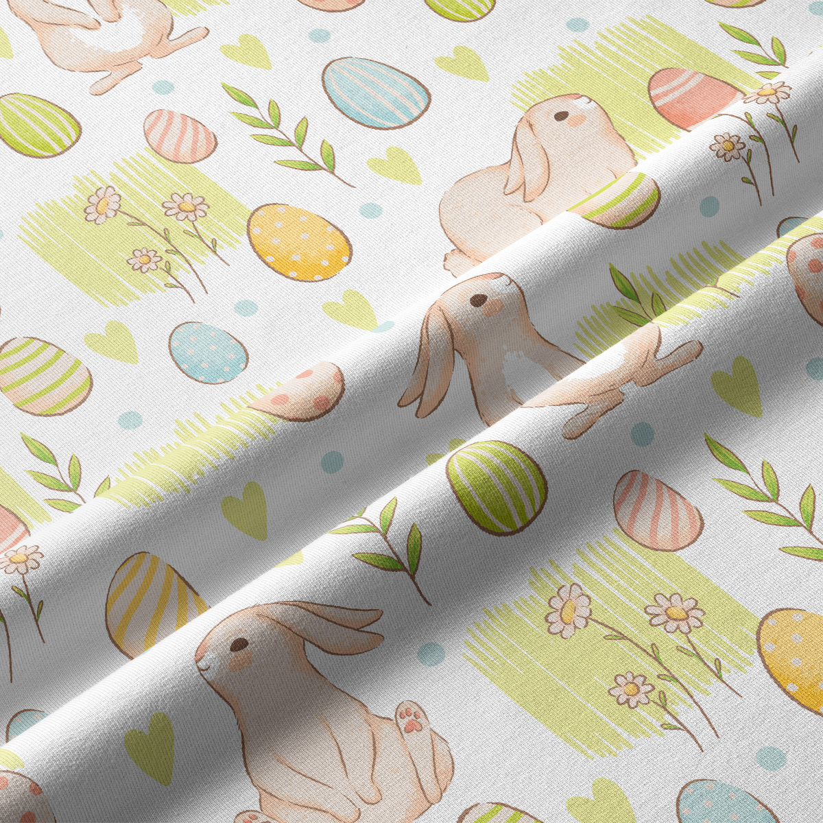 Zbliżenie na fakturę tkaniny i akwarelowe detale króliczka oraz pisanek