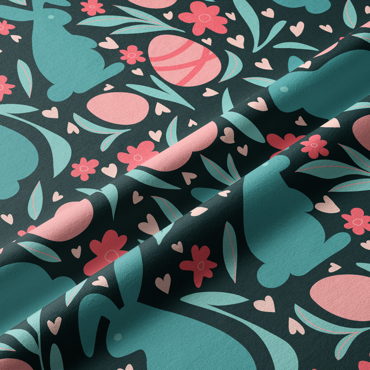 Zbliżenie na fakturę materiału i szczegóły nadruku z zajączkami, jajkami i kwiatami