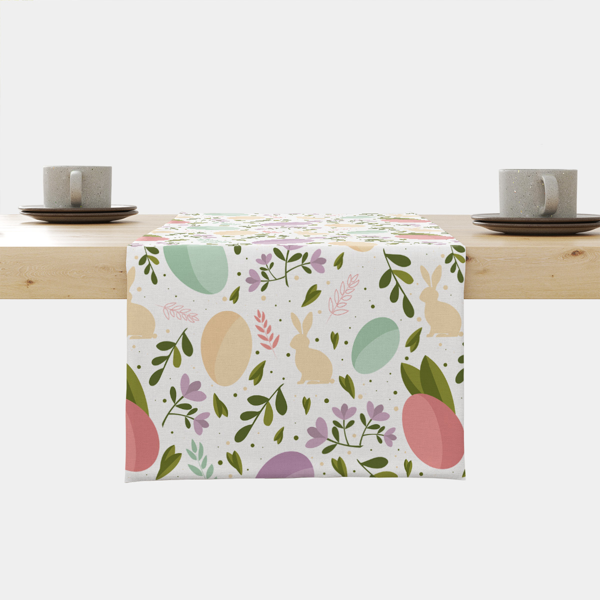 Bieżnik na stole z pastelowym wzorem pisanek i zajączków, widok frontalny