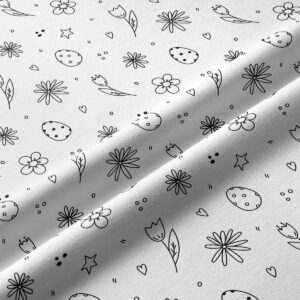 Zbliżenie na tkaninę i szczegóły wzoru z pisankami, tulipanami i drobnymi kwiatami