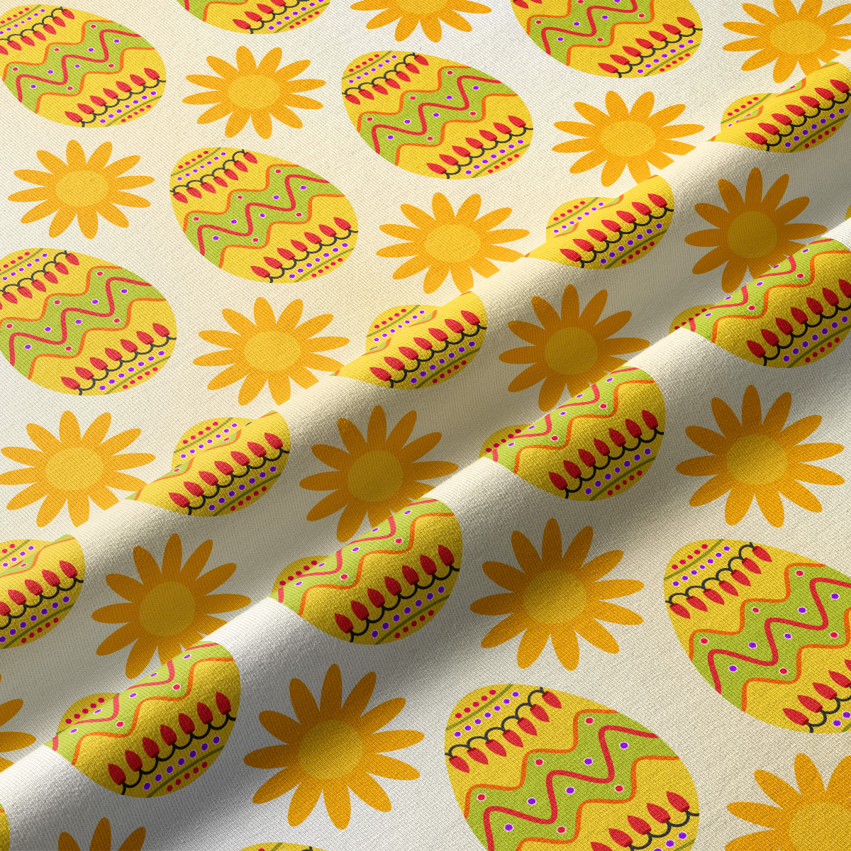 Zbliżenie na fakturę tkaniny i szczegóły kolorowych pisanek oraz słoneczek w nadruku