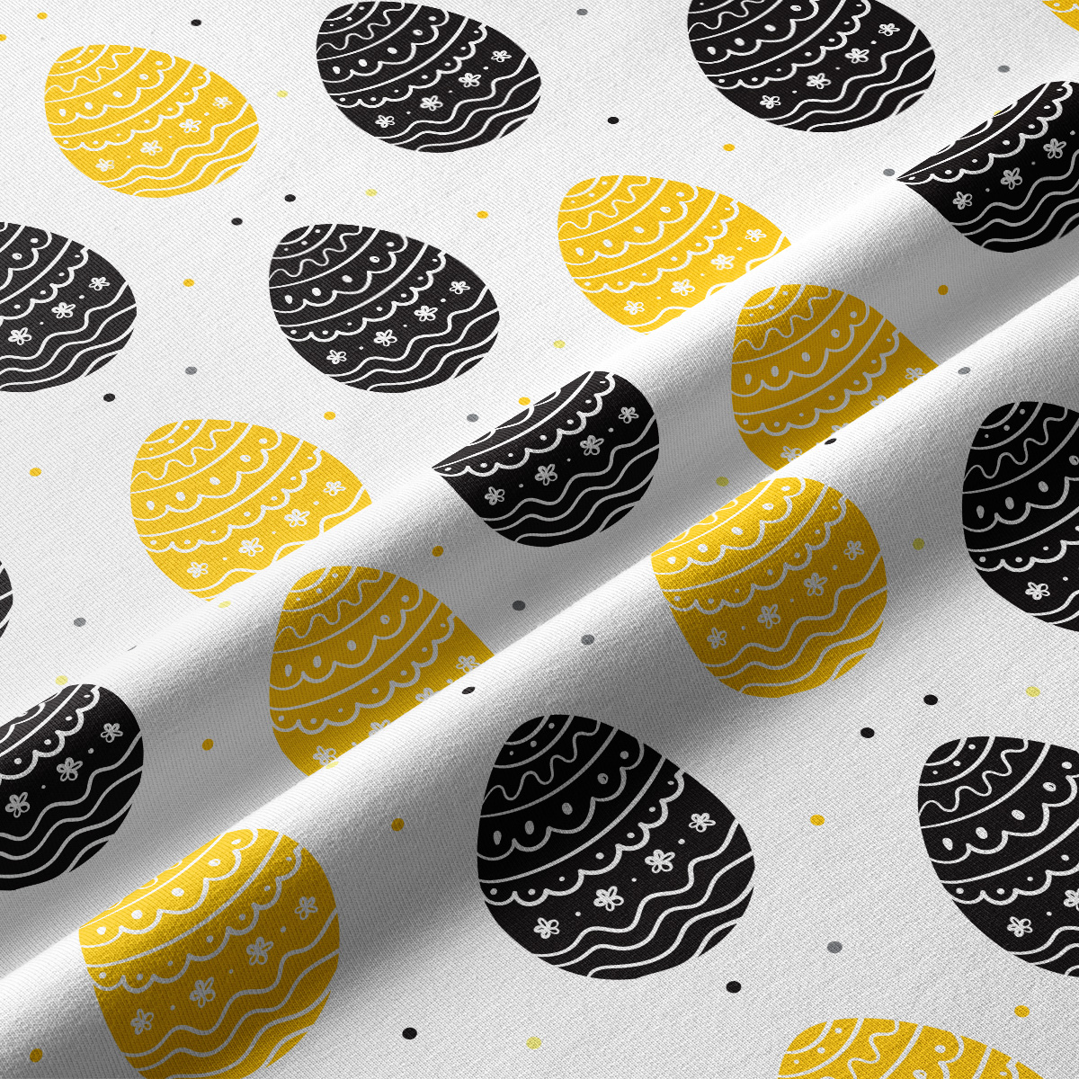 Zbliżenie na wzór pisanek i fakturę tkaniny z drobnymi kropkami