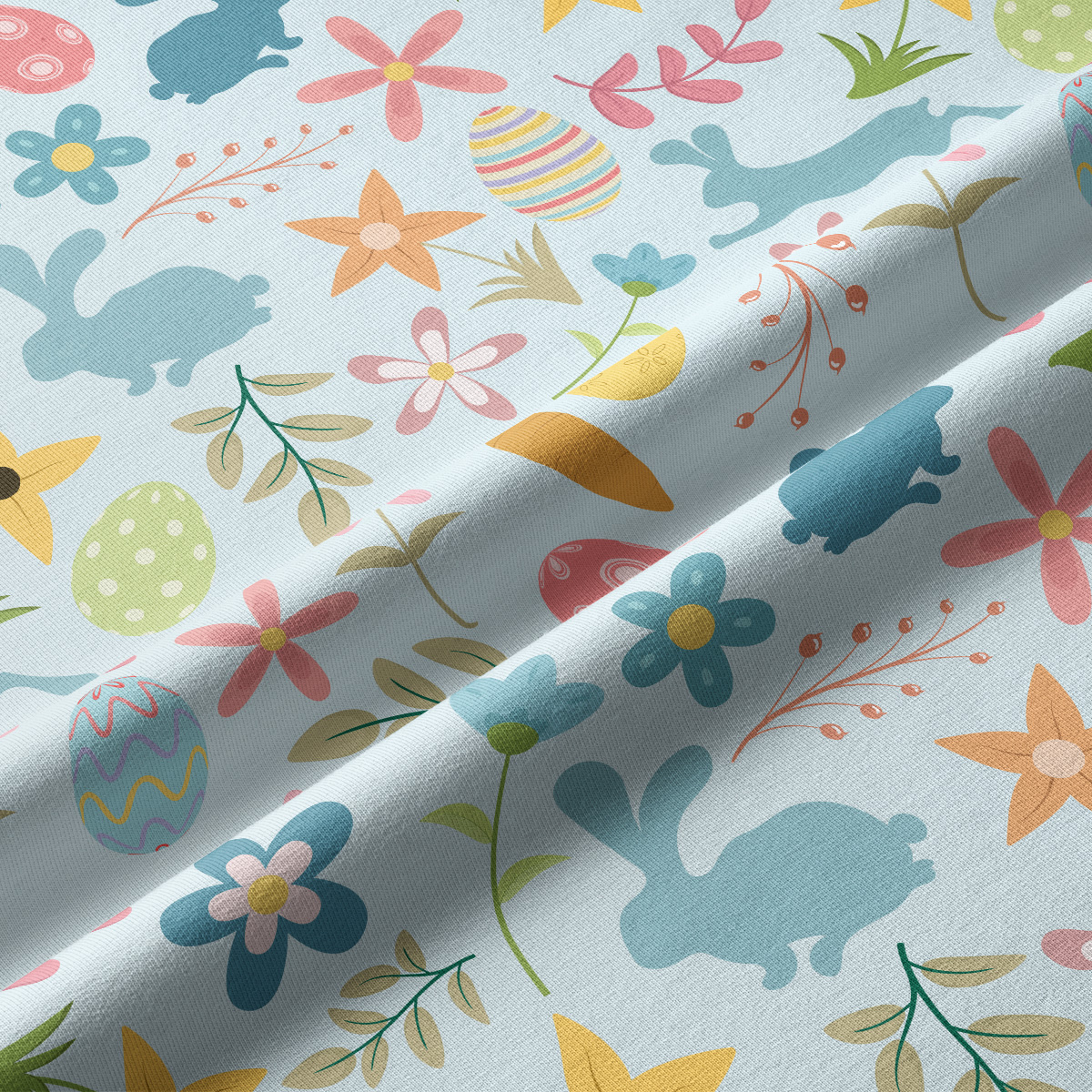 Zbliżenie na tkaninę pokazujące detale pisanek, kwiatów i sylwetek zajączków