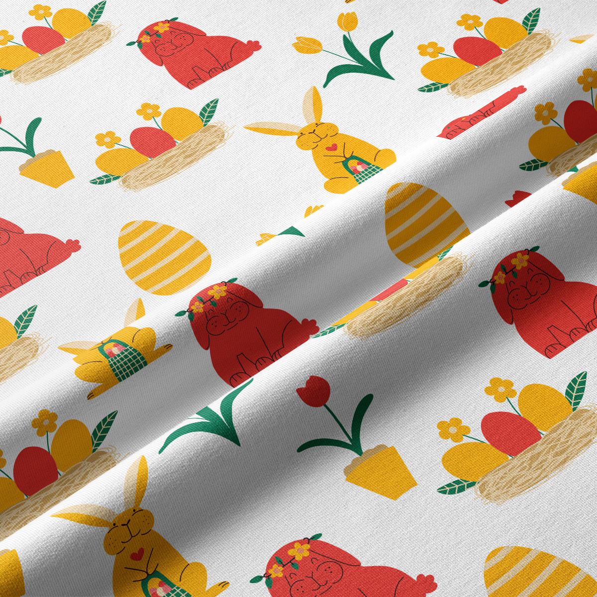 Zbliżenie na tkaninę z kolorowymi zajączkami i pisankami oraz widoczną fakturą materiału