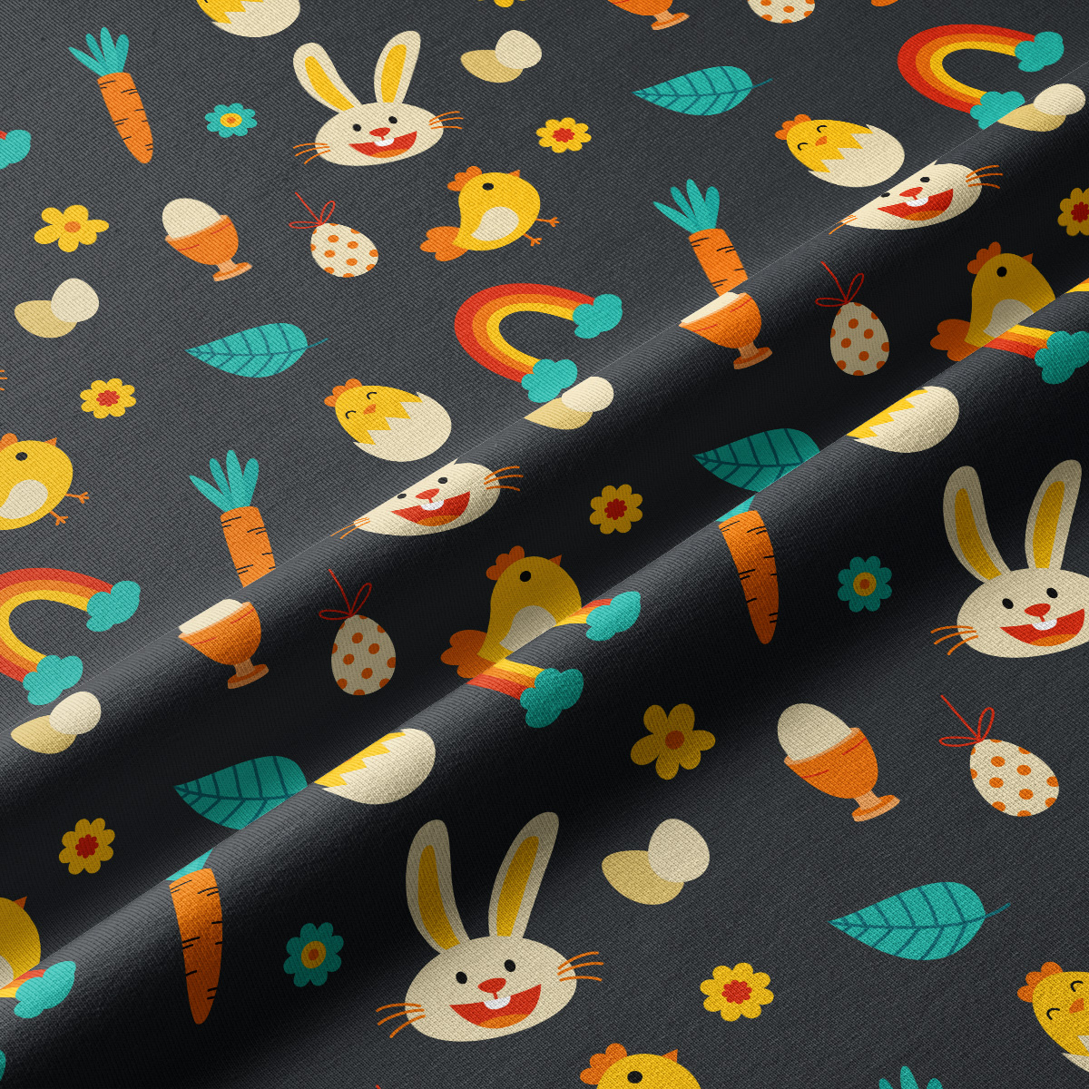 Zbliżenie na tkaninę pokazujące powtarzalny wzór z króliczkami, kurczaczkami, marchewkami i tęczami