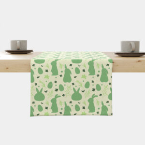 Bieżnik z motywem zielonych zajączków i pisanek rozłożony na stole, widok centralny