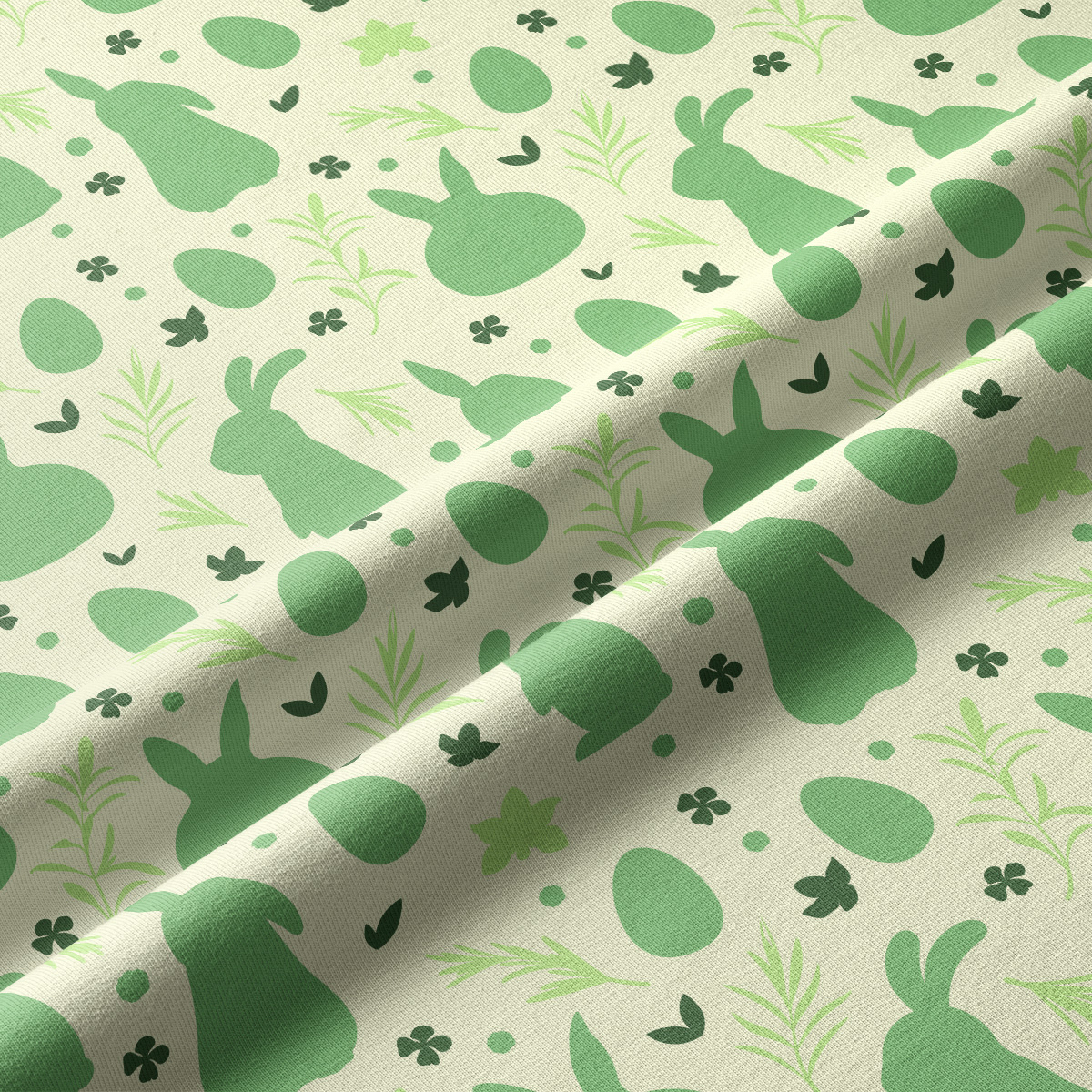 Zbliżenie na fakturę tkaniny i szczegóły wzoru z zajączkami, jajkami i listkami