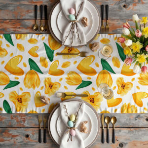 Aranżacja stołu z bieżnikiem, talerzami i wiosennymi dekoracjami w stylu wielkanocnym