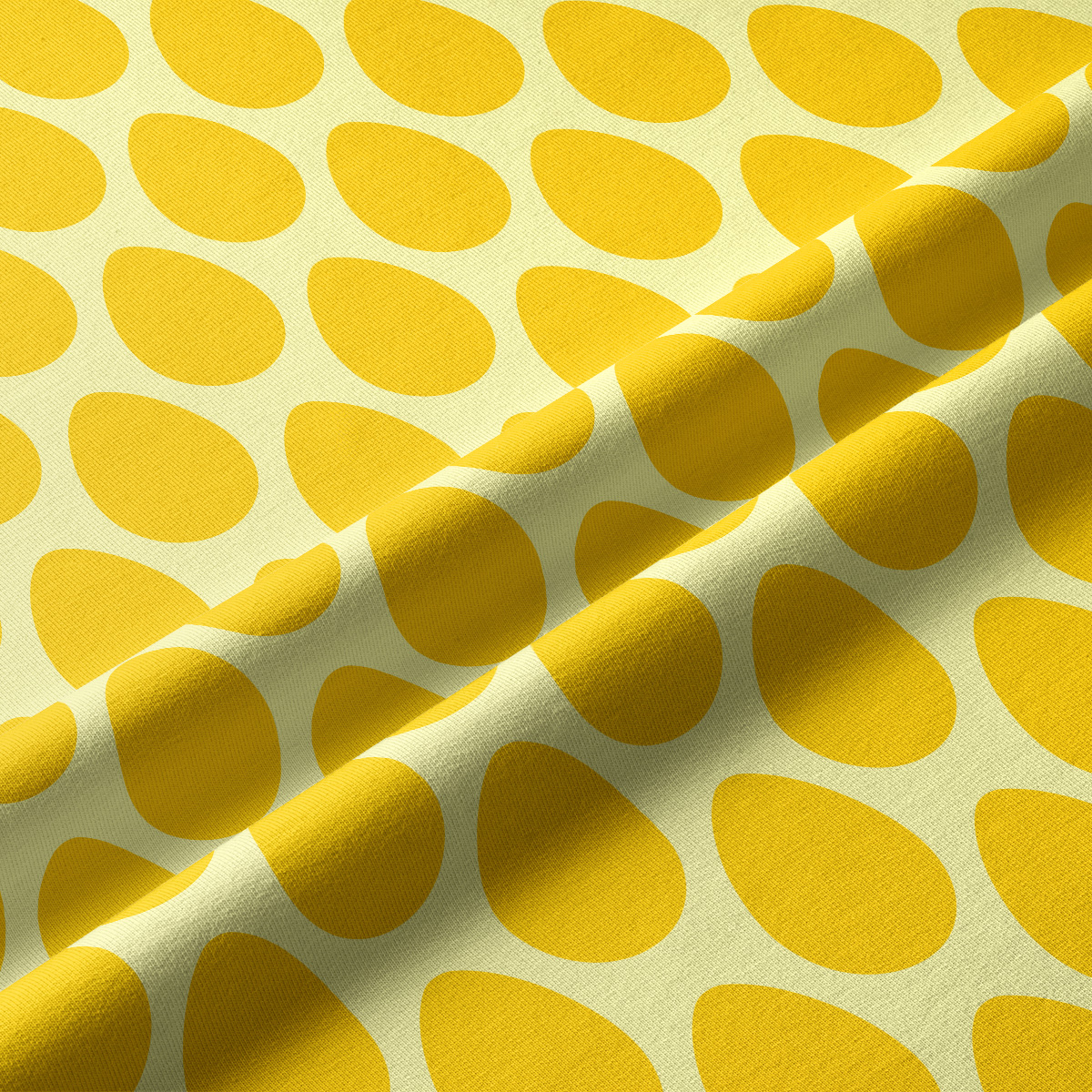 Zbliżenie na tkaninę i powtarzalny wzór żółtych pisanek