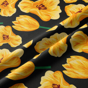 Zbliżenie na fakturę tkaniny i szczegóły żółtych tulipanów na czarnym tle