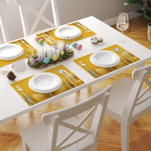 Kilka podkładek ułożonych na białym stole w wielkanocnej aranżacji