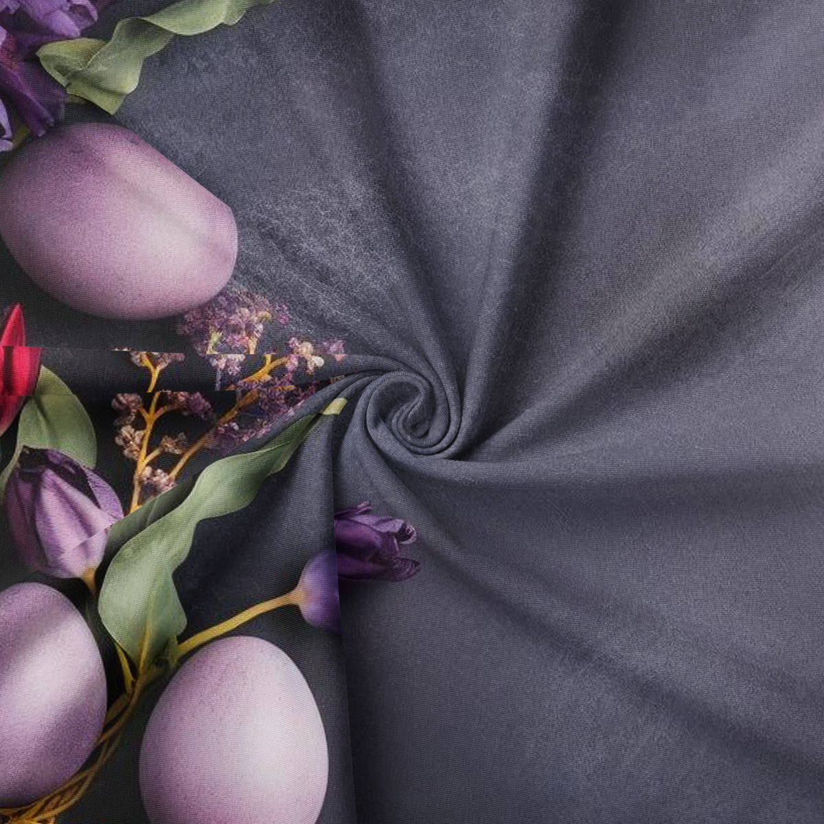 Zbliżenie na fakturę materiału i fragment nadruku z pastelowym jajkiem i listkami