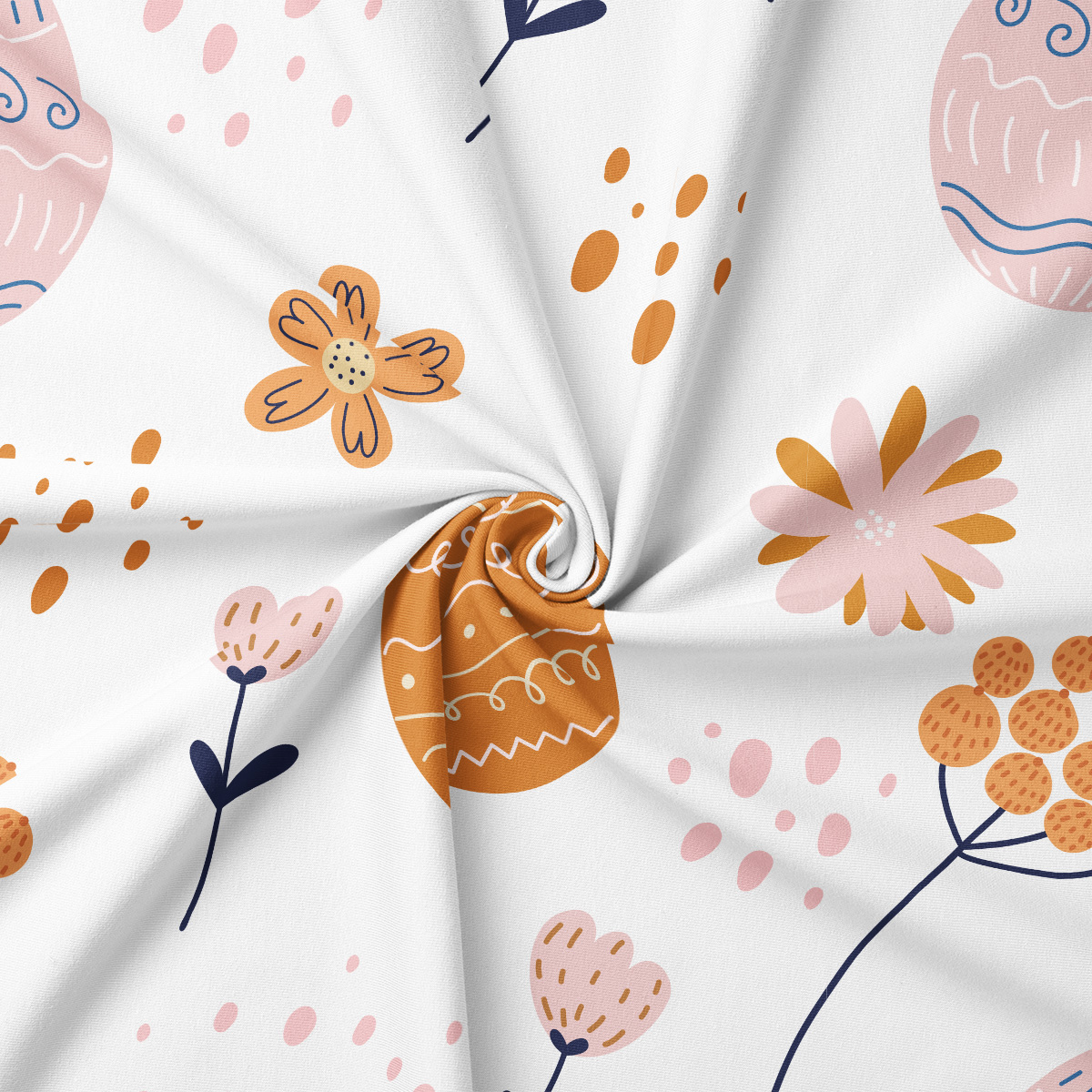 Zbliżenie na tkaninę z detalami pisanek, kwiatów i kropek pokazujące teksturę wzoru