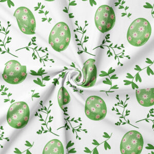 Zbliżenie na wzór tkaniny z zielonymi pisankami ozdobionymi małymi kwiatuszkami i delikatnymi listkami