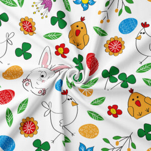 Zbliżenie na wzór z króliczkiem, kurczątkiem, barwnymi pisankami i zielonymi listkami z widoczną fakturą tkaniny