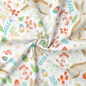 Zbliżenie na wzór i delikatną fakturę tkaniny z motywem zajączków, pisanek i drobnych kwiatów