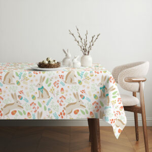 Aranżacja stołu z porcelanowymi dekoracjami i gałązkami bazi na obrusie w pastelowych kolorach