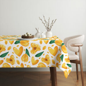 Aranżacja stołu z obrusem, dekoracjami wielkanocnymi i krzesłem przy ścianie