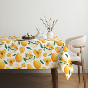 aranżacja stołu z porcelanowymi zającami i gałązkami na obrusem w wiosenny wzór