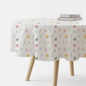 okrągły obrus w pastelowy wzór z pisankami i gałązkami na białym tle, ujęcie stołu z książkami