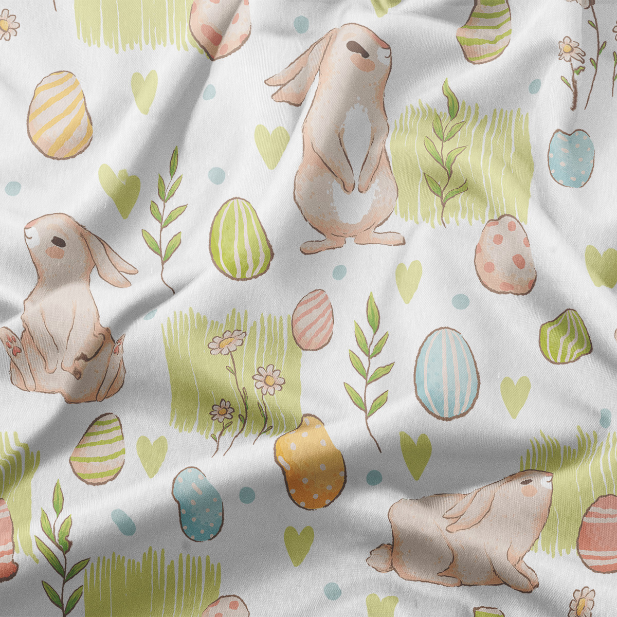 zbliżenie na tkaninę z akwarelowym wzorem króliczków, pisanek i zielonych akcentów